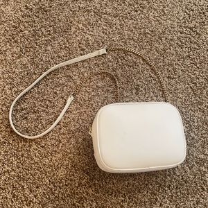 white and gold purse